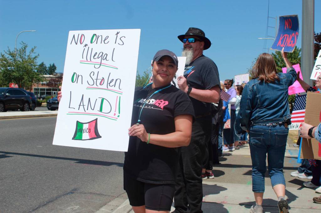 Many protesters mentioned the recent crackdown on immigration as part of their motivation for attending the rally in Federal Way, whether through signs or in interviews. Photo by Keelin Everly-Lang/the Mirror