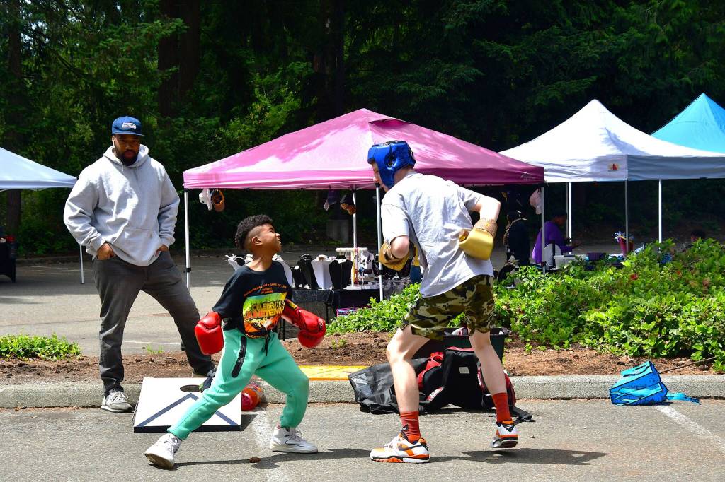 There were many activities for youth including this one at Juneteenth. Photo by Bruce Honda.