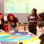 Local artists and community members come together to create a community mural at the Juneteenth event on June 14. Photo by Keelin Everly-Lang / the Mirror.