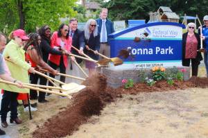 Local leaders and descendants of John and Mary Conna team up for the groundbreaking that kicks off the remodeling of the newly renamed Conna Park. Photo by Keelin Everly-Lang / the Mirror