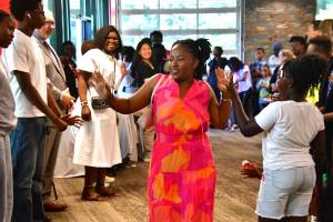 Youth Director of African Young Dreamers Empowerment Programs International (AYDEPI) Fiona Okech gets cheered on by community as she celebrates graduating college at the AYDEPI graduate celebration event on Saturday, June 28.