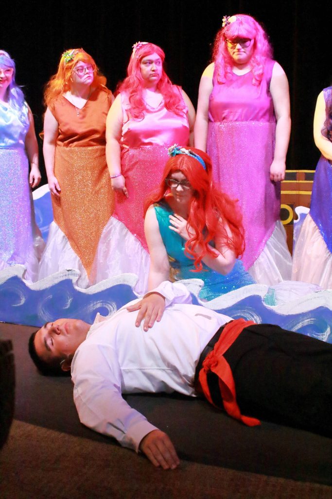 Madison Taylor as Ariel finds Joey Beltran as Prince Eric after the shipwreck in the Friendship Theatres performance of Disneys The Little Mermaid Jr. Photo by Keelin Everly-Lang / the Mirror