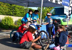 Kids learn about safety and bike maintenance at the Mirror Lake Bike Safety Day in May 2025. Photo by Shelley Pauls.