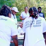 AYDEPI youth gather to celebrate one members birthday with cake at the volunteer event. Photo by Keelin Everly-Lang / The Mirror