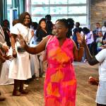 Youth Director of African Young Dreamers Empowerment Programs International (AYDEPI) Fiona Okech gets cheered on by community as she celebrates graduating college at the AYDEPI graduate celebration event on June 28, 2025. Photo by Bruce Honda