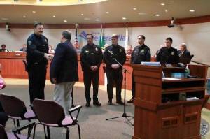 Federal Way Mayor Jim Ferrell shaking a new police recruits hand. Photo by Keelin Everly-Lang/The Mirror