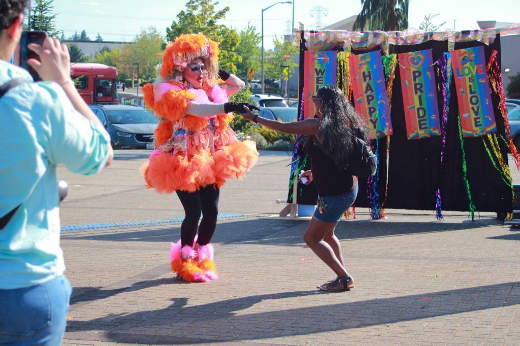 Octavia Alstoemeria dances with a member of the audience at Federal Way Pride.