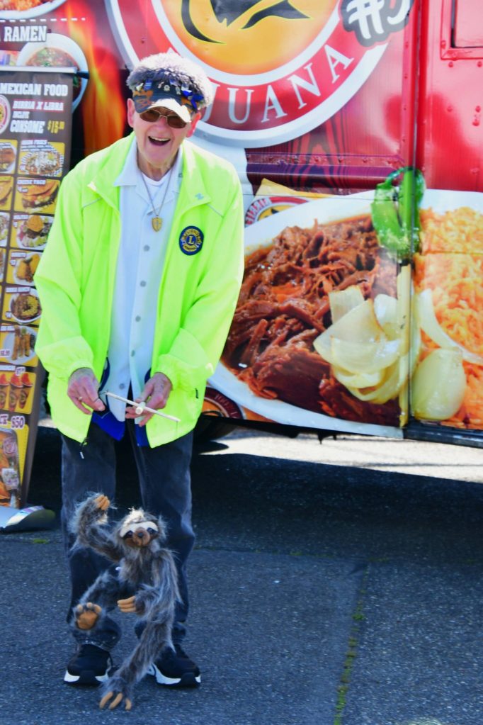 Bob Darrigan with a puppet at the Federal Way Farmers Market. Photo by Bruce Honda