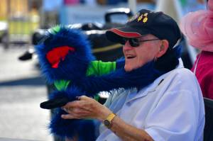 Bob Darrigan with a puppet at the Federal Way Farmers Market. Photo by Bruce Honda