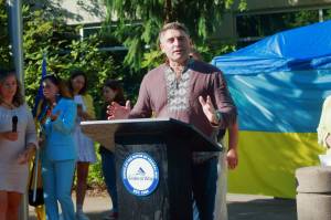 Local Ukrainian community leader and South King Fire Chaplain Vitaliy Piekhotin speaks at the first Ukrainian flag raising. Photo by Keelin Everly-Lang / the Mirror