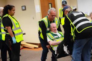 Community members practice a chair carry during their emergency training at a Basic Course of CERT in 2024. Photo by Keelin Everly-Lang / the Mirror