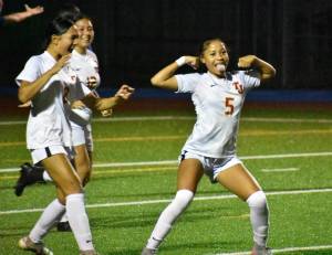 Malieta Redmond celebrates her goal against Auburn Mountainview. Ben Ray / The Mirror
