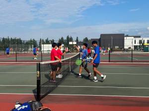 Thomas Jeffersons No. 1 doubles team of Vincent and Joshua Pham shake hands with Auburn Mountainviews No. 1 doubles team of Imani Brown and Vinh Nguyen. Nathan Hyun / For the Mirror