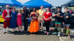 From left to right: Oscar Torres Morales, Meggin Hunt, The Love Grubs, Evelyn Thompson, David Metz, Karly Burmark, Siaki Failautusi, Toaoaiga McConville. Photo courtesy of Vickie Chynoweth