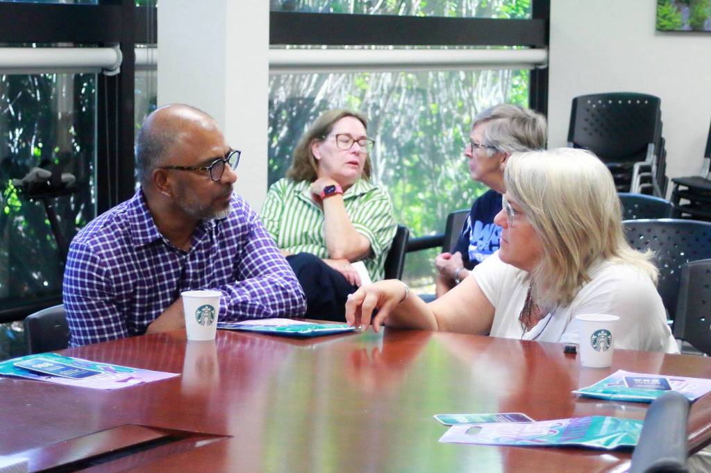 Community members and local leaders connect with each other and Valley Cities Behavioral Health CEO Shekh Ali. Photo by Keelin Everly-Lang / the Mirror