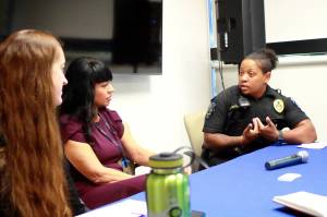 Jessica Rosado and Teri Hardy from Valley Cities discuss suicide prevention strategies in Federal Way with police officer Sarah Montjoy after the quarterly coffee chat on Sept. 17. Photo by Keelin Everly-Lang/the Mirror