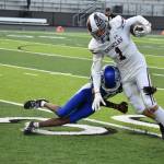 Jay Sinclair makes a tackle on Jason Feddema of Enumclaw. Ben Ray / The Mirror