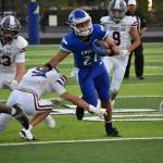 Ray Rondon breaks a tackle against the Enumclaw Hornets. Ben Ray / The Mirror