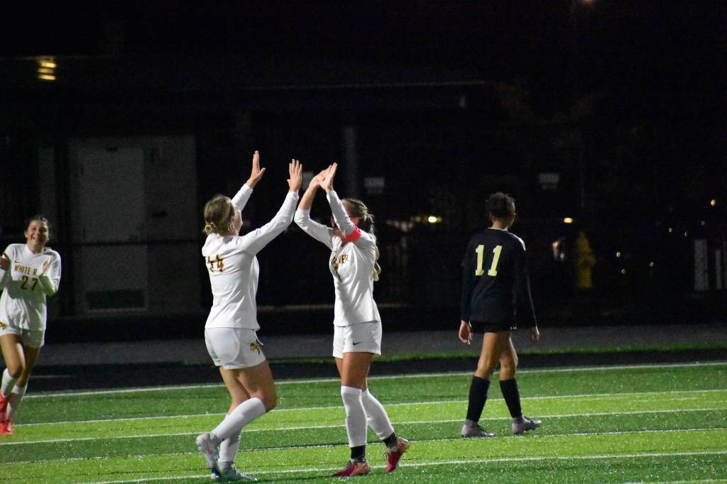 Riley Soule and Adalyn Sykes celebrate a goal against Decatur. Ben Ray / The Mirror