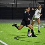 Amani Hussen hits a shot against White River for Decaturs second goal of the game. Ben Ray / The Mirror