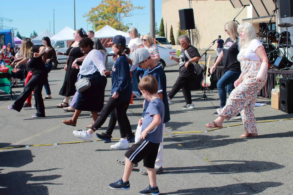 Sharon Gentry of Curves led a line dance to finish of Taste of Federal Way 2025. Photo by Keelin Everly-Lang / the Mirror