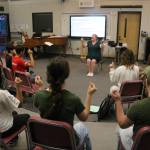 Colle Voce gets their voices and limbs ready to go during a Monday rehearsal. Photo by Bailey Jo Josie/Sound Publishing.