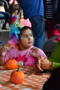 Guests of all ages enjoyed hands-on activities like pumpkin decorating and face painting at the Fall Festival on Saturday, Oct. 4. Photo by Bruce Honda