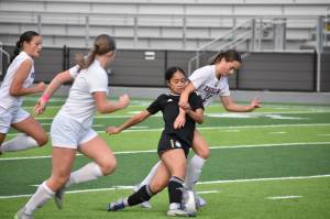 Kaihea Tuifua fights through contact against Enumclaw. Ben Ray / The Mirror