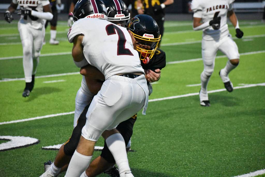 Mabin Guillen fights a Kentlake tackle for Thomas Jefferson. Nathan Hyun.