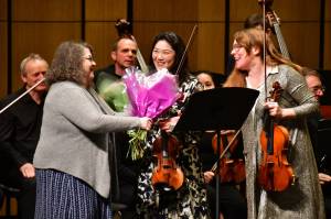 The recent Federal Way Symphony concert ends with a splash as flowers and accolades are shared. Photo by Bruce Honda.