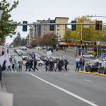 Protesters fill street corners and march across the street during the No Kings demonstration in Federal Way on Oct. 18. Photo by Rachel Jones