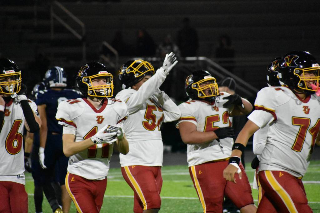 Thomas Jefferson players celebrate their first win of the season. Ben Ray / The Mirror