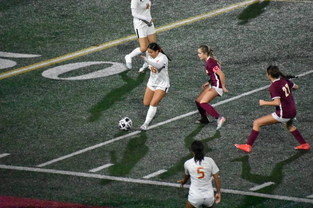 Jordynn Koria clears the ball for Thomas Jefferson against White River. Photo by Ben Ray/The Mirror