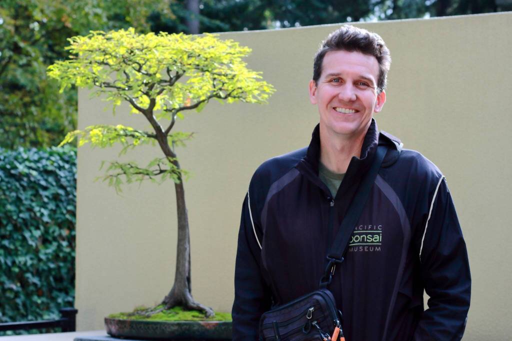 Pacific Bonsai Museum curator Aarin Packard designs the museums exhibits and focuses on both celebrating the art of bonsai and providing education through the miniature living trees. Photos by Keelin Everly-Lang / the Mirror
