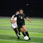 Amani Hussen dribbles the ball for Decatur down the field. Ben Ray / The Mirror