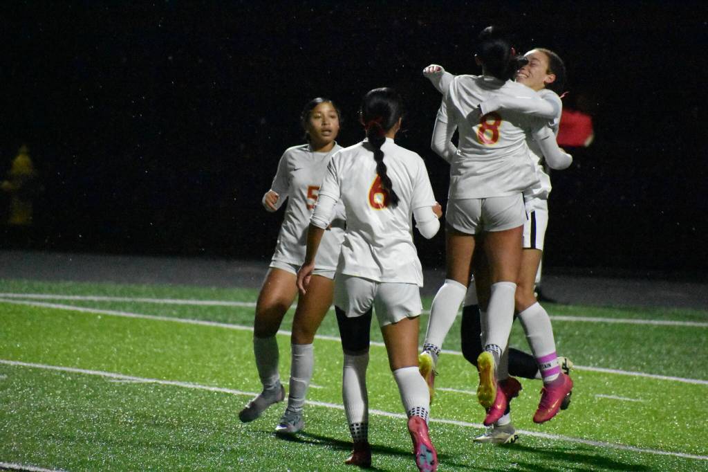 Jazmyne DuBose and Athena Amor Katsaros celebrate the Raiders first goal. Ben Ray / The Mirror