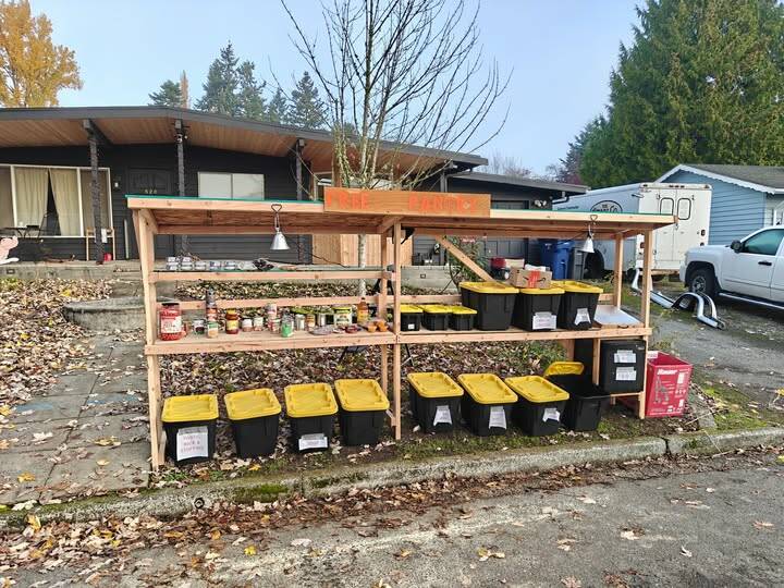 The community pantry doubled in size as Tim and Zoey Moen managed the flow of both donations and neighbors in need who responded to their act of kindness. Courtesy photo.