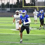 Federal Ways Zamarie Tellez runs away from the Decatur defense for a touchdown. Ben Ray / Sound Publishing