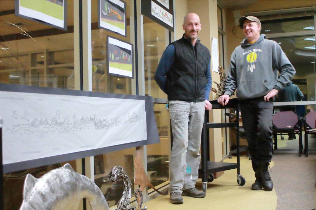 Artists Ben Dye and Travis Pond show their proposal and examples of fabrication for their Stewards of a Living City art proposal for Federal Way. Photo by Keelin Everly-Lang / the Mirror