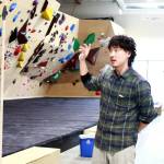 Founder Seung Park describes the details that make Climb NORA stand out, like high quality grips, employing two full-time setters to build new routes every six weeks, and even the dimensions of the space, including leaving space between the climbing walls and the ceiling. Photo by Keelin Everly-Lang / the Mirror