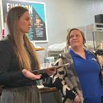 The Federal Way Community Centers Sabrina Bates, inclusion coordinator, and Brittany Marth, inclusion assistant, talk about the citys programs for people with disabilities during the Federal Way Mirrors Hot off the Presses community conversation Dec. 9 at Poverty Bay Cafe. Staff photo