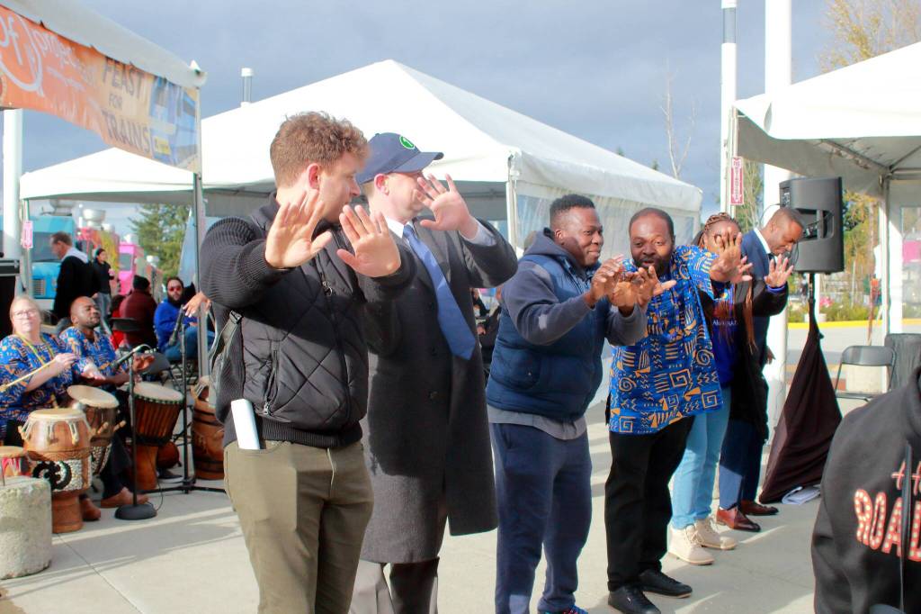 The crowd joined in the performance to learn a dance from group Anokye Agofomma at Star Lake station during the grand opening of three new stops on Dec. 6. Photo by Keelin Everly-Lang / the Mirror