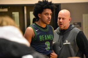 Doni Burkett and Todd Beamer head coach Brent Brilhante talk at the end of the game. Ben Ray / The Mirror