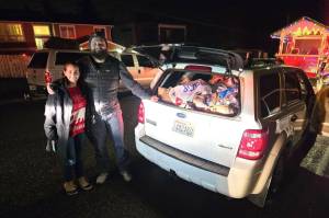 Community members donating food during the Santa Parade and food drive. Courtesy photo.