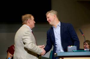 King County Councilmember Pete von Reichbauer, who represents the Federal Way area, greets Jeopardy! host Ken Jennings after the county council recognized the game show legend Jan. 6. Jennings is known for his 74-game win streak on the show in 2004. Courtesy photo