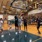 Titans Jeremiah Johnson goes up for a rebound. Nathan Hyun / For the Mirror