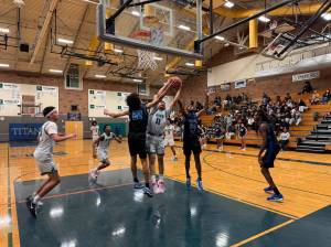 Titans Jeremiah Johnson goes up for a rebound. Nathan Hyun / For the Mirror