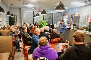 New Federal Way City Councilmember Martin Moore connects with constituents at the Federal Way Mirrors monthly community event, Hot off the Presses, on Jan. 14 at Poverty Bay Cafe. Photo by Bruce Honda