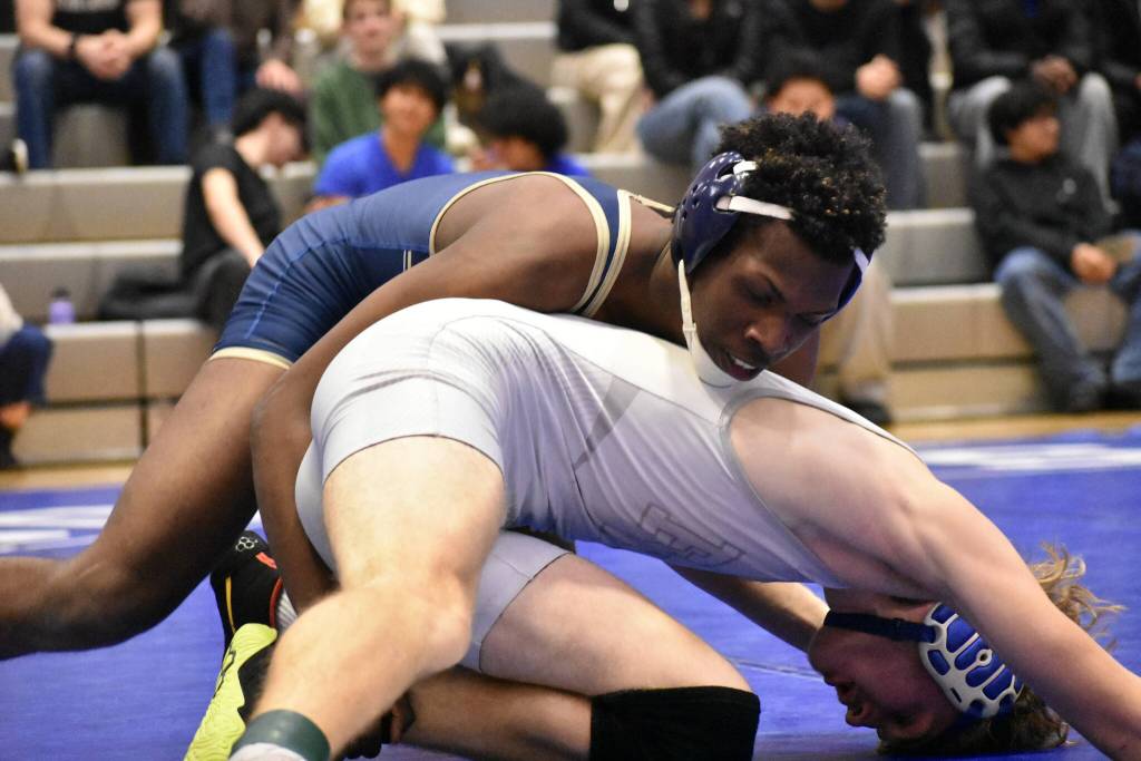 Jayden Walker is on top of his opponent from Federal Way. Ben Ray / The Mirror