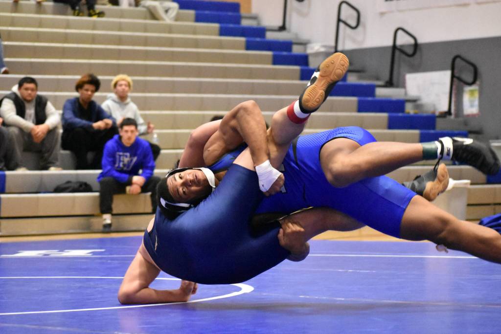 Kaicen Carter drives his opponent to the ground. Ben Ray / The Mirror